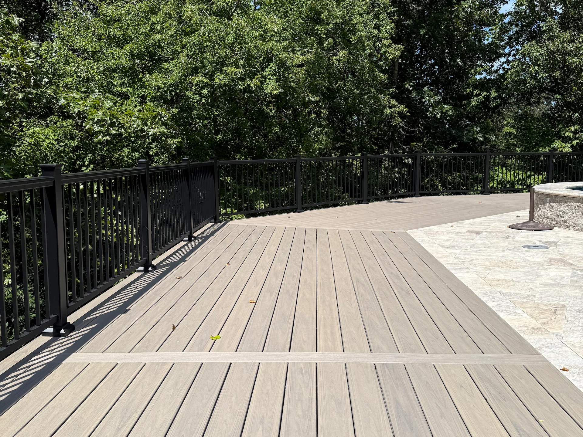 Composite deck with black metal railing